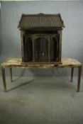 † A large carved 18th-19th century Chinese ancestor house with gilded and painted detail sitting