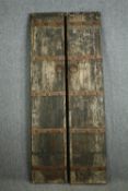 † A pair of Chinese 19th century hardwood and metal bound courtyard/temple doors. H.204 W.41cm. (