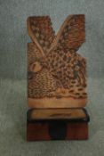 † An African relief carved hardwood palaver chair in the form of a vulture. H.80 W.50 D.48cm.