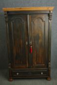 A 19th century stained pine wardrobe. H.179 W.103 D.53cm.