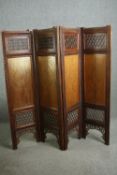 An Indian carved pierced hardwood and brass inlaid four leaf screen, circa 1900. H.176 W.188cm.
