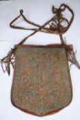 An early 20th century leather and silver thread embroidered shoulder bag. H.24 W.20cm.