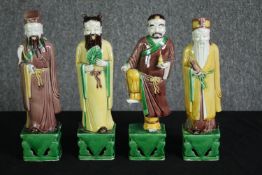 TR10718 † Four 19th century Chinese Taoist Sancai glaze ceramic figures of immortals. H.28cm. (