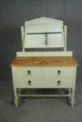 An early 20th century oak dressing table, later painted. H.146 W.103 D.48cm.