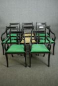 A set of eight Regency style ebonized dining chairs including two carvers