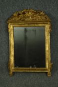 A late 18th century North European carved giltwood wall mirror. H.66 W.45cm.