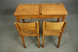 A vintage beech wood double school desk along with a pair of laminated ply chairs. H.66 W.102 D.