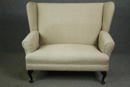 A George II style mahogany settee. H.106 W.130 D.67cm.