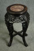 A late 19th century Chinese carved rosewood plant stand with rouge marble inlaid top. H.62cm.