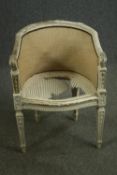 A 19th century French Louis XVI style white painted bergère chair (caned seat damaged)