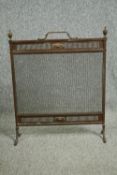An Edwardian Adam style brass fire screen, H.70 W.56cm.