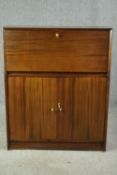 A mid 20th century teak drinks cabinet. H.113 W.91 D.28cm.