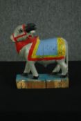 A primitive carved and painted Nandi cow. H.25 W.20 D.7cm.