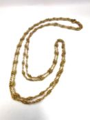 A French 19th century 18ct yellow gold fancy link muff chain with C-sprung clasp. Stamped with
