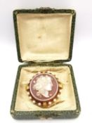 A boxed 19th century French yellow metal (tests as 18ct) mounted carnelian cameo pendant brooch,