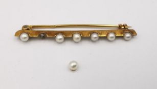 A French antique pearl set 18ct yellow gold bar brooch, set with seven round white pearls (one