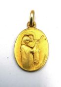 Jacques Martin, an oval 18ct yellow gold religious pendant with Mary and Jesus and a cross on the