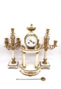 A 19th century Louis XVI style white marble and gilt metal mantel clock with twin candelabra
