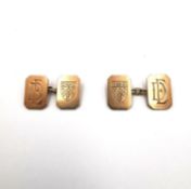 A pair of Art Deco 9ct rose chain link gold cuff links by Owen Powell, one side with coat of arms