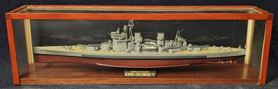 A ship's model of the King George V battleship, in a perspex show case
