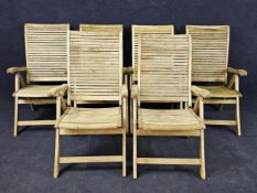 A set of six teak garden recliners