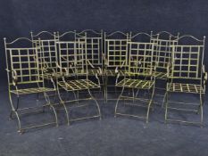 A set of eight bent steel garden chairs.