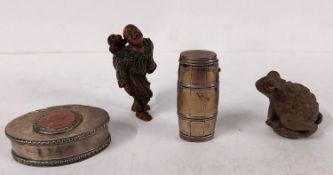 Two Japanese carved wood netsukes, one of a toad and one of a man with hair being pulled by a monkey
