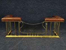 An Edwardian style brass and leather club fender. H.57 W.166 D.58cm.