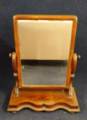 A Victorian walnut dressing table mirror. H.67.5 W.59.5 D.27.5cm