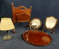 A George II style mahogany tray, a magazine rack, shield dressing table mirror, another mirror and a