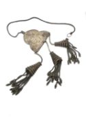 An early 20th century white metal (tests as silver) oriental robe adornment with silver snake