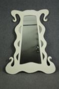A large contemporary dressing mirror with a white lacquered shaped frame. H.138 W.106cm.