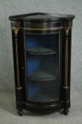 A Victorian ebonized and gilt metal mounted standing corner display cabinet. H.110 W.65 D.44cm.
