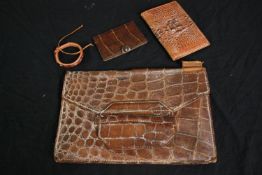 A group of four vintage crocodile skin tan leather items, including a bag, a purse, a card holder