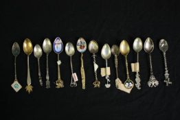A collection of silver, white metal and enamelled commemorative teaspoons from around the word. L.