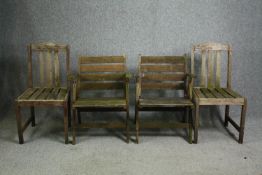 A pair of weathered teak slatted folding garden armchairs, and another pair of side chairs.