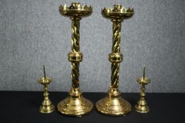 A pair of brass church candlesticks, and a smaller pair of pricket candlesticks. H.51cm. (largest).