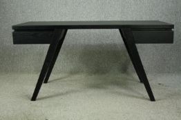 A contemporary mid century style ebonized desk. H.75 W.150 D.65cm.