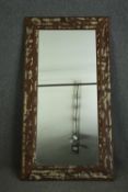 A hardwood dressing mirror with a distressed finish. H.168 W.86cm.
