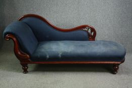 A Victorian carved mahogany chaise longue. H.88 W.185 D.60cm.