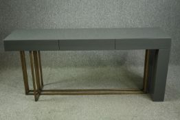 A contemporary designer lacquered and gilt metal console table by Meridiani. H.75 W.172 D.45cm.