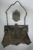 A German Art Nouveau white metal chainmail bag with inset cobochon, stamped 'German Silver', and a
