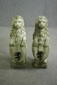 A pair of garden statuary hearaldic lions in composite stone. H.77cm. (each).
