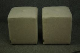 Two contemporary pouffes, in beige textured upholstery. H.45 W.40 D.40cm. (each).