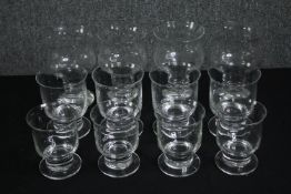 Three sets of four wine glasses with flared rims. H.14cm. (largest).