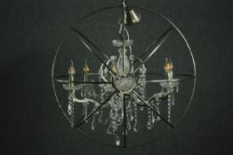 A contemporary designer cut glass and steel framed chandelier. H.99cm.