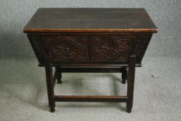 A 17th century style carved oak dough bin, 19th century. H.74 W.88 D.59cm.