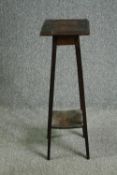 A late 19th century oak plant stand. H.81cm.