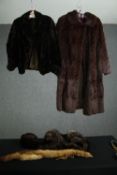 Two vintage fur coats, one moleskin, a mink stole, a hat and another accessory.