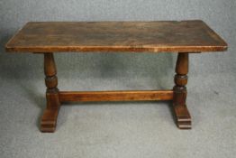 A 19th century provincial oak refectory dining table on trestle end supports. H.73 W.156 D.71cm.